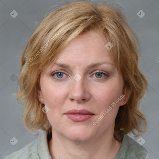 Joyful white young-adult female with medium  brown hair and blue eyes