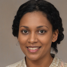 Joyful black young-adult female with medium  brown hair and brown eyes