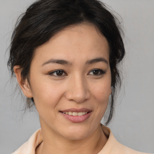 Joyful asian young-adult female with medium  brown hair and brown eyes