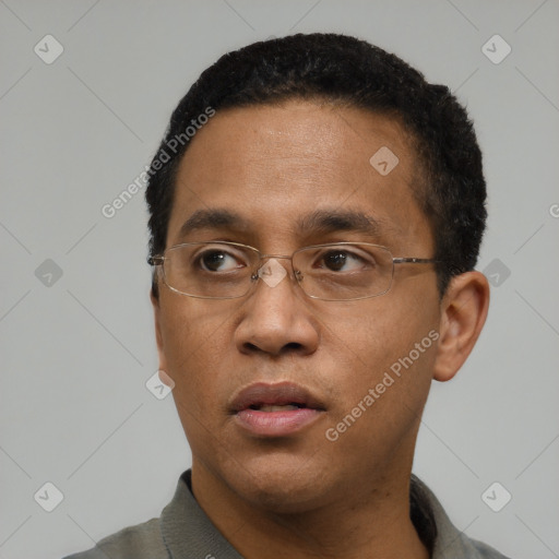 Neutral black adult male with short  black hair and brown eyes