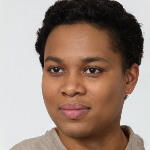 Joyful black young-adult female with short  black hair and brown eyes