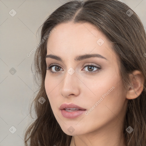 Neutral white young-adult female with long  brown hair and brown eyes