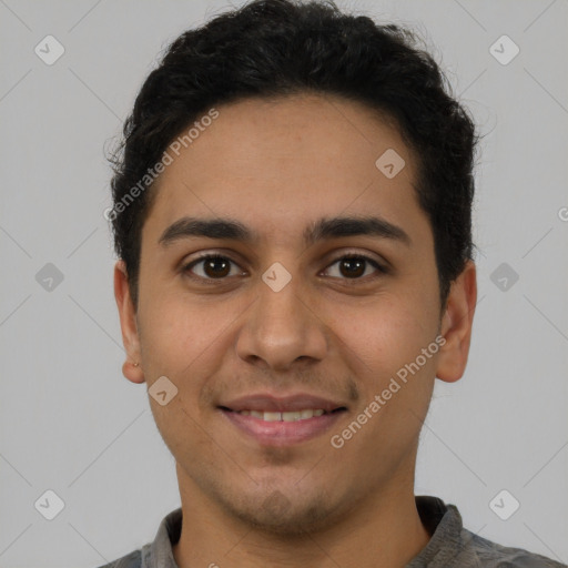 Joyful latino young-adult male with short  brown hair and brown eyes