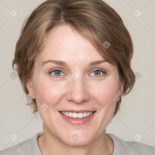 Joyful white adult female with medium  brown hair and blue eyes