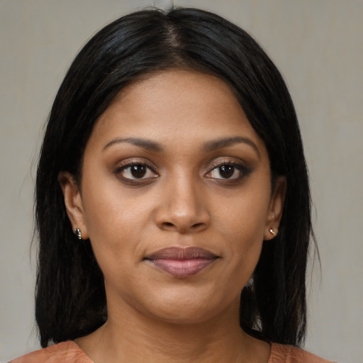 Joyful asian young-adult female with medium  black hair and brown eyes