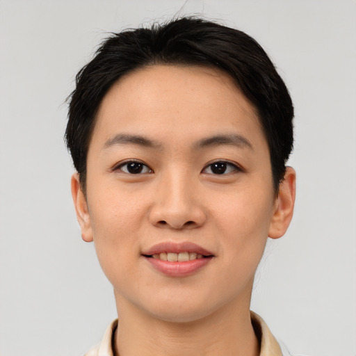 Joyful asian young-adult female with short  brown hair and brown eyes
