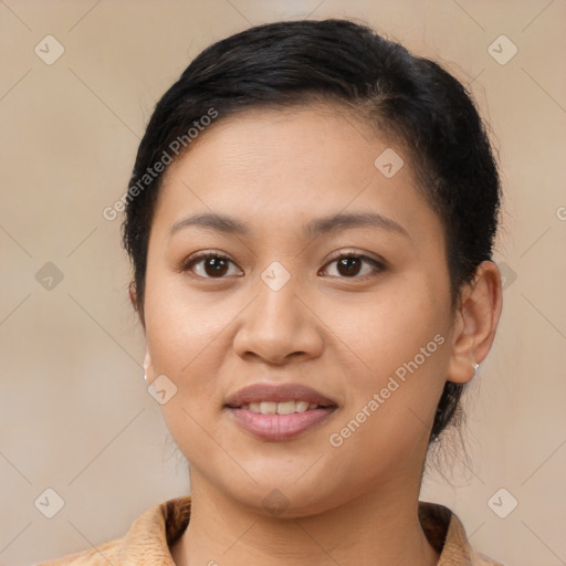 Joyful latino young-adult female with medium  brown hair and brown eyes