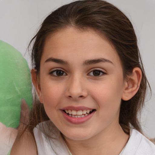 Joyful white child female with medium  brown hair and brown eyes