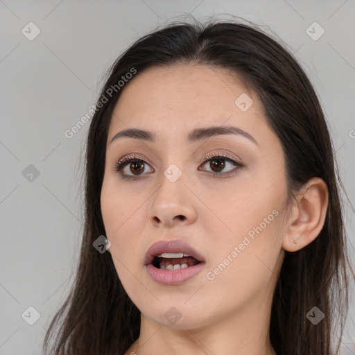 Joyful white young-adult female with long  brown hair and brown eyes