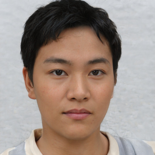 Neutral asian young-adult male with short  brown hair and brown eyes