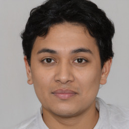 Neutral latino young-adult male with short  brown hair and brown eyes