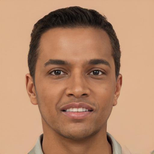 Joyful latino young-adult male with short  brown hair and brown eyes