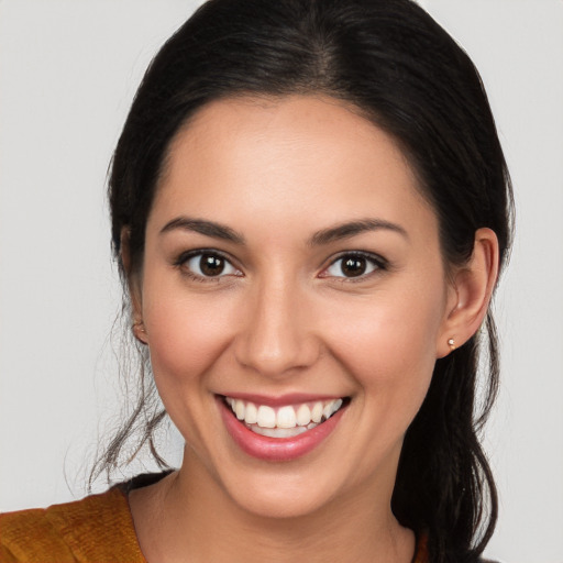 Joyful white young-adult female with long  brown hair and brown eyes