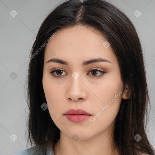 Neutral white young-adult female with long  brown hair and brown eyes