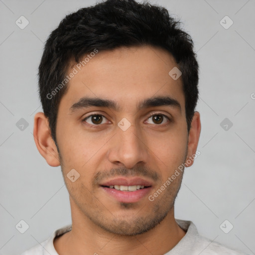 Joyful latino young-adult male with short  black hair and brown eyes