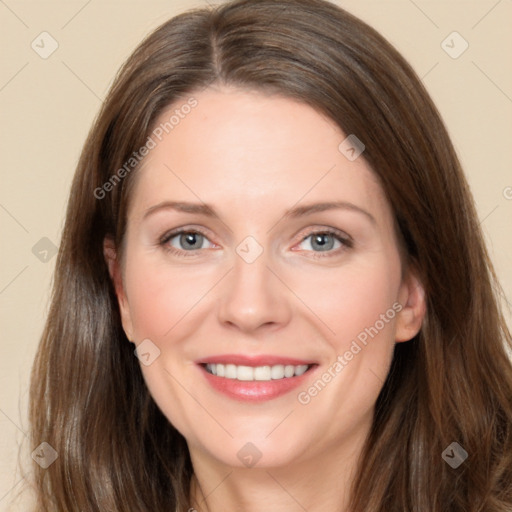 Joyful white adult female with long  brown hair and brown eyes