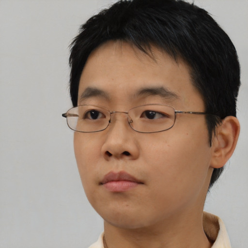 Neutral asian young-adult male with short  black hair and brown eyes