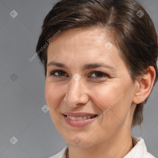 Joyful white adult female with medium  brown hair and brown eyes