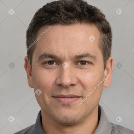 Joyful white adult male with short  brown hair and brown eyes