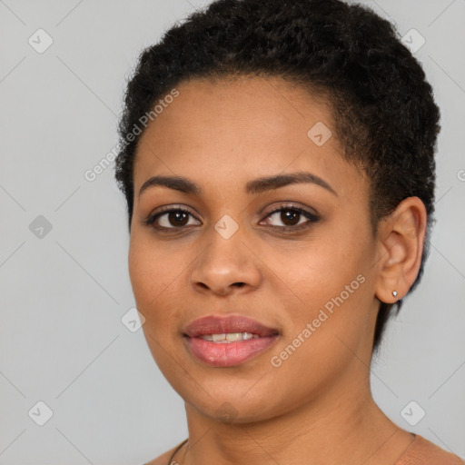 Joyful black young-adult female with short  brown hair and brown eyes