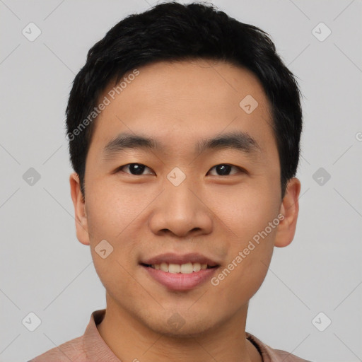 Joyful asian young-adult male with short  black hair and brown eyes