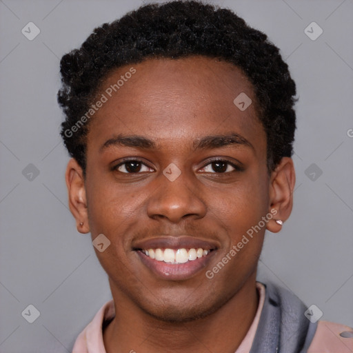 Joyful black young-adult male with short  brown hair and brown eyes