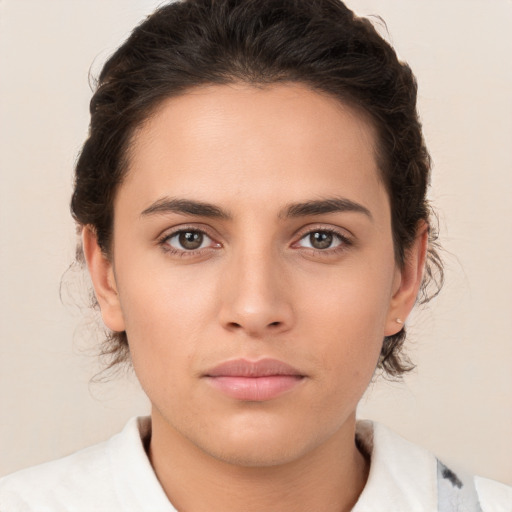 Neutral white young-adult female with medium  brown hair and brown eyes