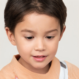 Joyful white child female with short  brown hair and brown eyes