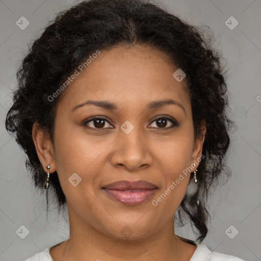 Joyful black adult female with medium  brown hair and brown eyes