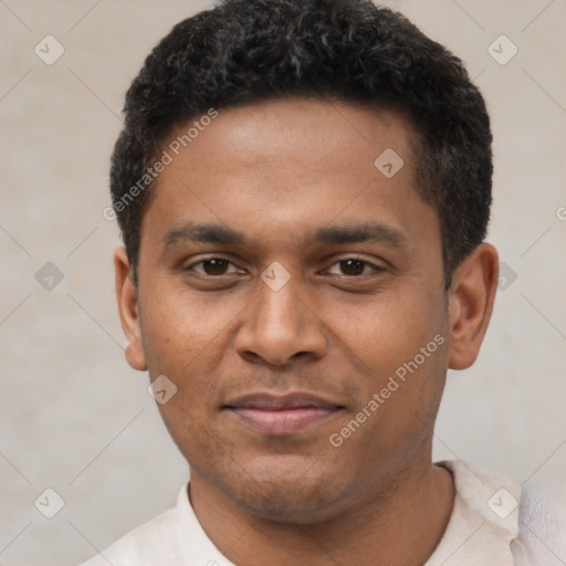 Joyful latino young-adult male with short  black hair and brown eyes