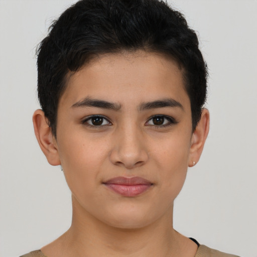 Joyful latino young-adult female with short  brown hair and brown eyes