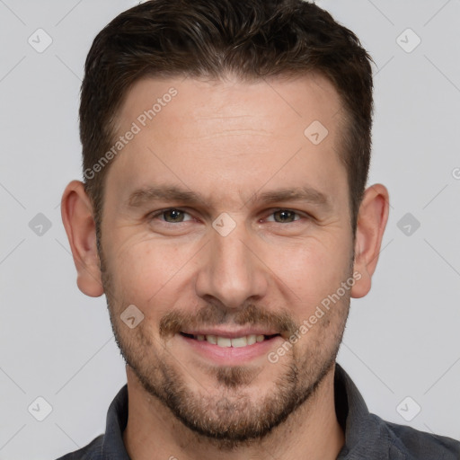 Joyful white adult male with short  brown hair and brown eyes