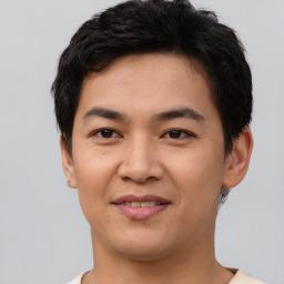 Joyful asian young-adult male with short  black hair and brown eyes