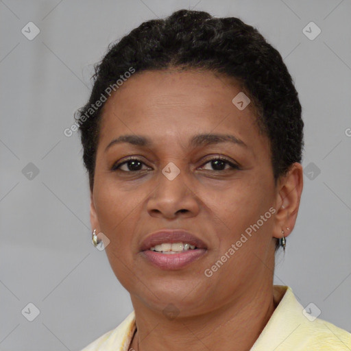 Joyful black adult female with short  brown hair and brown eyes