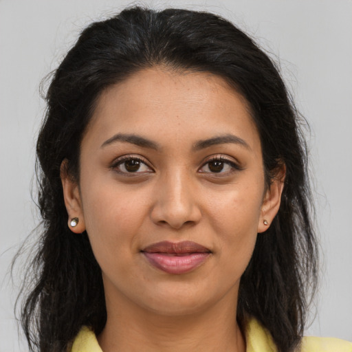 Joyful asian young-adult female with long  brown hair and brown eyes