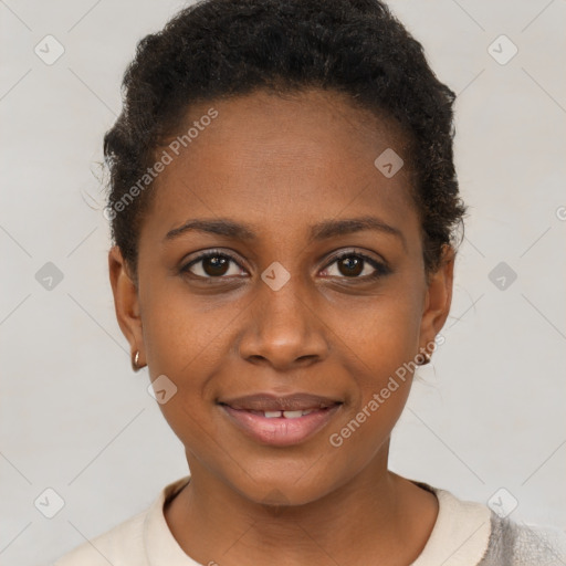 Joyful black young-adult female with short  brown hair and brown eyes