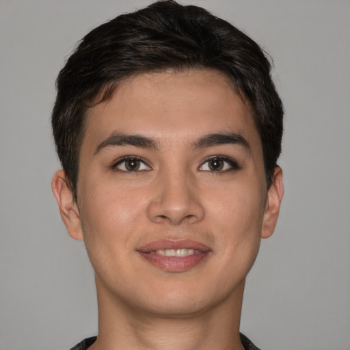 Joyful asian young-adult male with short  brown hair and brown eyes