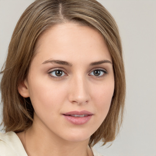 Neutral white young-adult female with medium  brown hair and brown eyes