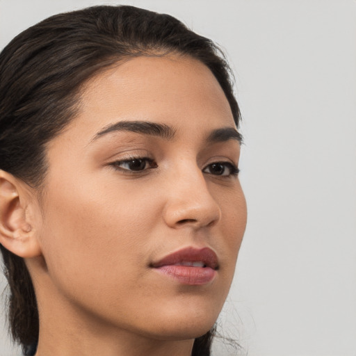 Neutral white young-adult female with medium  brown hair and brown eyes