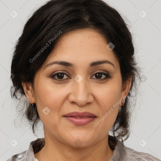 Joyful latino adult female with medium  brown hair and brown eyes