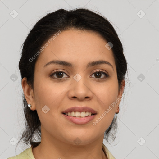 Joyful latino young-adult female with medium  brown hair and brown eyes