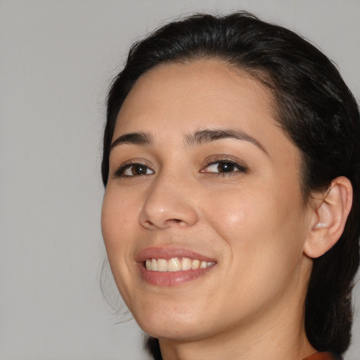 Joyful white young-adult female with medium  black hair and brown eyes