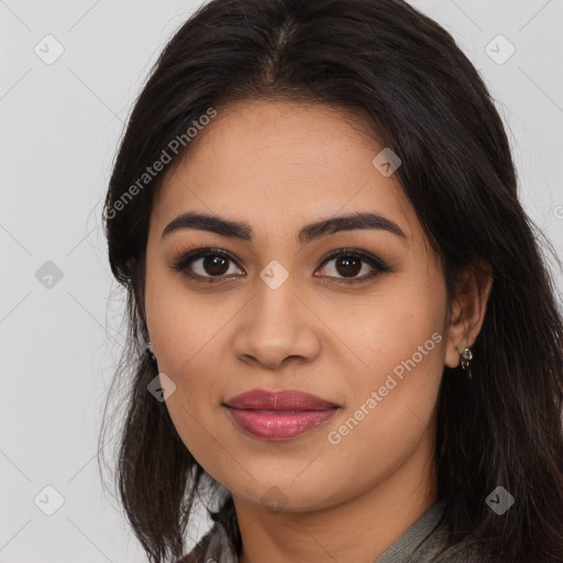 Joyful latino young-adult female with long  brown hair and brown eyes