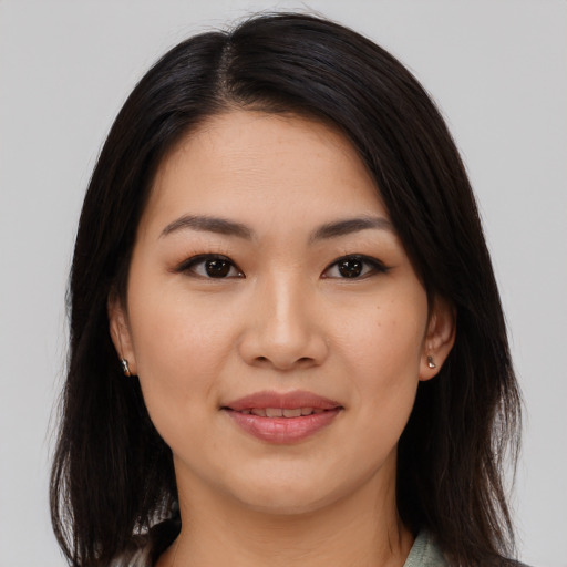 Joyful white young-adult female with medium  brown hair and brown eyes