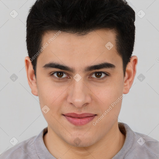 Joyful latino young-adult male with short  brown hair and brown eyes