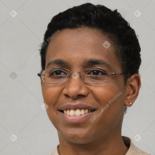 Joyful black adult male with short  brown hair and brown eyes