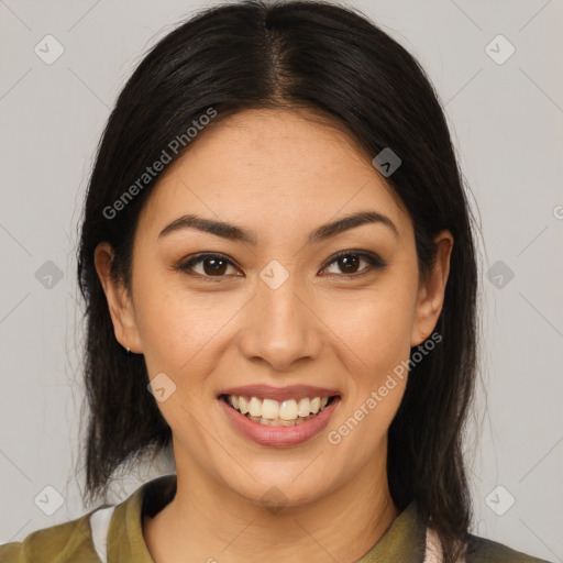 Joyful latino young-adult female with medium  brown hair and brown eyes