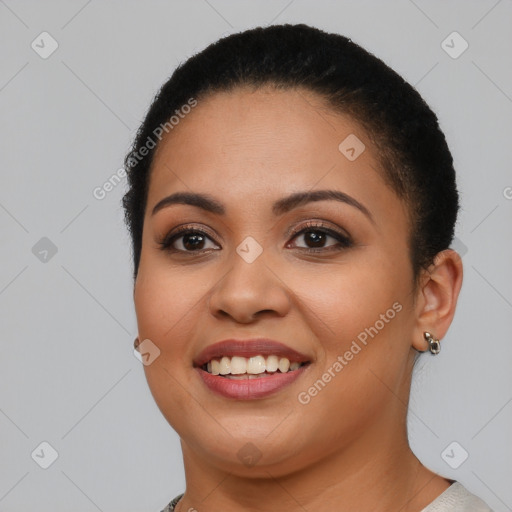 Joyful latino young-adult female with short  brown hair and brown eyes