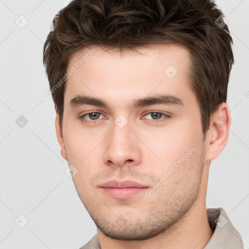 Neutral white young-adult male with short  brown hair and brown eyes