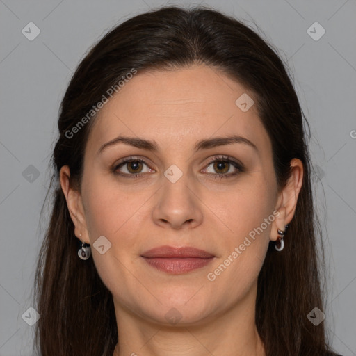 Joyful white adult female with long  brown hair and brown eyes